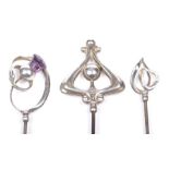 A collection of three Edwardian Charles Horner Silver hat pins Each with foliate and scrolling