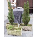 A group of three reconstituted garden stone planters Each of rectangular form,