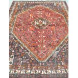 A Bokhara style medallion rug The central hexagonal form medallion with stylized flower head motif