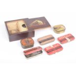 A collection of various gramophone needle case To include a wooden His Masters Voice example,
