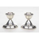 A pair of Silver dwarf Candlesticks The domed circular bases, rising to a flared candle sconce, W.