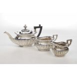 A Silver three-piece tea service To include a twin handled sugar bowl,