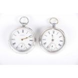 A silver pocket key wind watch With a white dial and black Roman numerals,