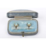 A pair of 18k gold and turquoise studs Stamped '18ct', cased The Goldsmiths & Silversmiths Co. Ltd.