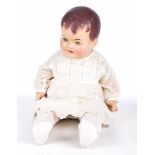 A mid 20th Century bisque headed doll With painted face and moveable eyes with plush body and