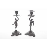 A pair of 19th Century Spelter candlesticks Modelled as Mercury and Fortuna forming the central