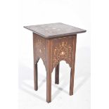 A late 19th early 20th Century inlaid jardiniere stand in the style of Liberty The square top