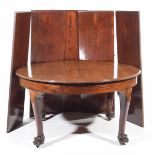 An exceptional mid 19th Century mahogany extending dining table The circular moulded table top with