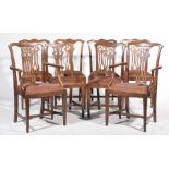 A set of eight oak Chippendale style dining chairs,