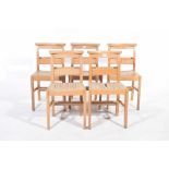 A set of five beechwood chapel chairs Each chair with a rail back and rear book trough,