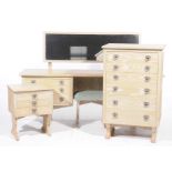A mid 20th Century limed oak four piece bedroom suite Comprising a dressing table with a long