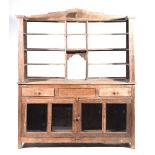 A stripped rustic hardwood shop counter/display cabinet The super structure back with a stepped