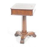 An early 19th Century mahogany work table The rectangular twin hinged top concealing a removable