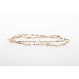 A 9k gold and pearl necklace The twisted baton links, interspaced with pearls, weight approx. 5.