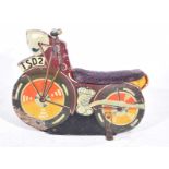 A vintage mid 20th Century fairground wooden motorcycle The carved and painted model bike with