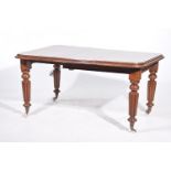 A Victorian mahogany extending dining table The rectangular moulded top with rounded corners and