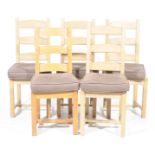 A matched set five contemporary beech wood kitchen chairs Each with a three rung back above an
