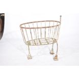 A vintage cast iron manger The openwork basket raised on three stepped tripod legs with good all