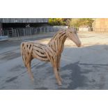 A decorative drift wood figure a horse Beautifully comprising various pieces of driftwood formed