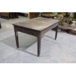 A late 19th early 20th Century stained pine work table The rectangular top with rounded corners
