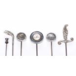 A collection of Silver and white metal hat pins To include a silver sword handled hat pin,