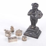 A patinated cast iron figure of a Court Official The rotund figure wearing court dress and hat,