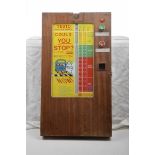 A 1960's wall mounted "Testo Reaction Meter Game" The wooden case with glass central panel and