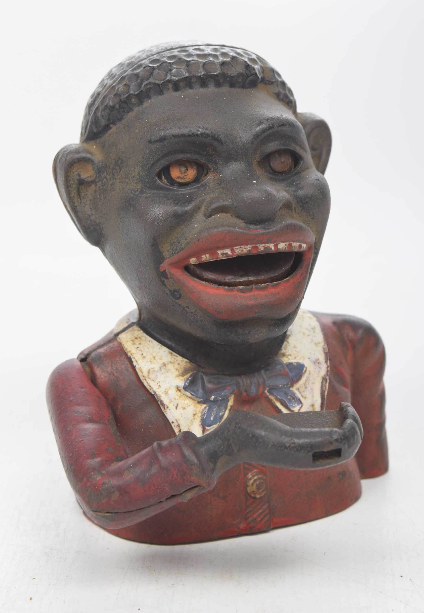 A Blackmoor cast metal and painted money box Cast has a jovial male figure,