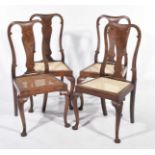 A set of four early 20th Century Queen Anne style walnut bedroom chairs Each with a vase shaped