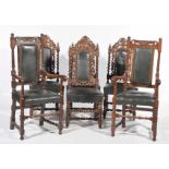 A set four Victorian carved dining chairs and two similar elbow chairs The four chairs with an
