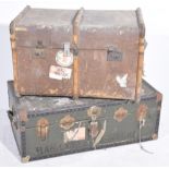 Two vintage travelling trunks The first a green and metal bound studded case,