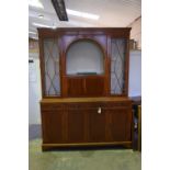 A Georgian influence yew wood wall display cabinet With a dentil cornice above glazed doors,
