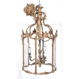 An early 19th Century French Rococo style four glass lantern The gilt metal acanthus cast six