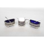 A matched Silver cruet set To include a pair of salts with spoons,