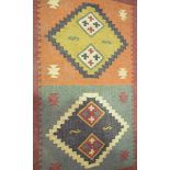 A Turkish Kilim style rug The flat woven rug with rich red,