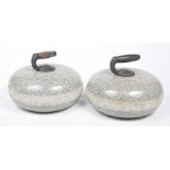 A pair of curling stones The granite polished stone of rounded form applied with a bronze and