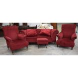 An early 20th Century red velour drop-end Chesterfield type sofa With a deep set scroll arm raised