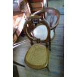 An Edwardian inlaid mahogany circular tub chair,