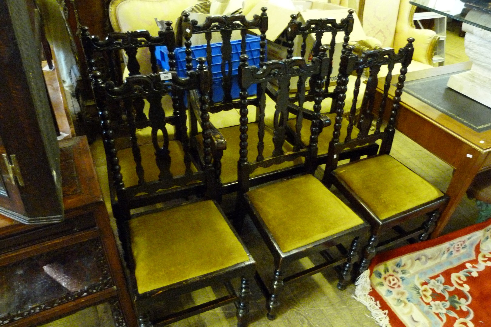 A set of six early 20th Century carved oak dining chairs.