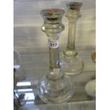 A pair of late 19th/early 20th Century pressed clear glass candlesticks, 26cm high.