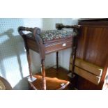 An early 20th Century beech wood piano stool with hinged seat.