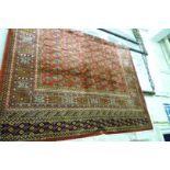 A red ground Bokhara carpet, approx 2.3x1.6m.