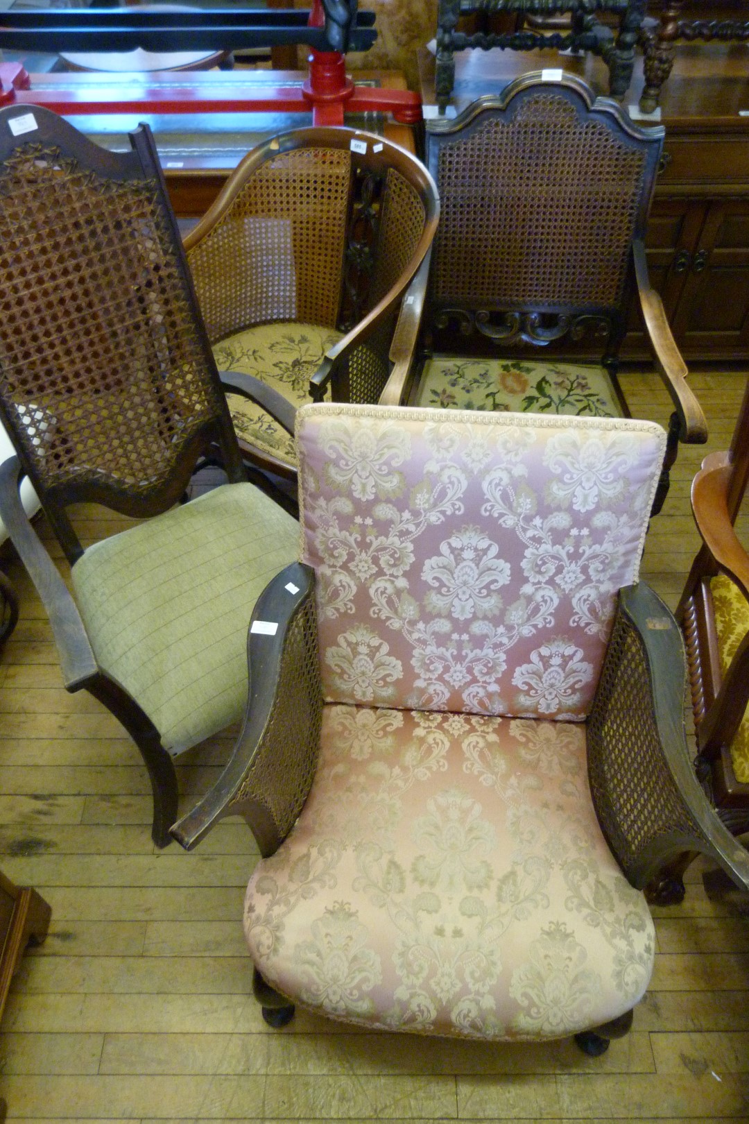 Four early 20th Century cane work bedroom chairs.
