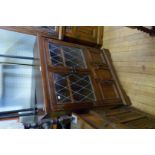 A good quality Old Charm solid oak bookcase,