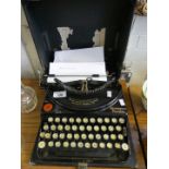 A portable Remington typewriter.