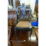 A Victorian hand painted papier mache single chair, having cane seated base.