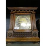 An early 20th Century mantel clock in architectural carved case.