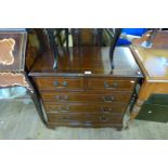 A reproduction mahogany narrow chest of two short over three long drawers.