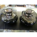 A pair of 20th Century Continental ceramic and silver overlaid chamberstick with floral decoration,
