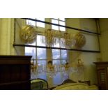 Eight good quality reproduction chandeliers each having cut glass droplets comprising two pairs and